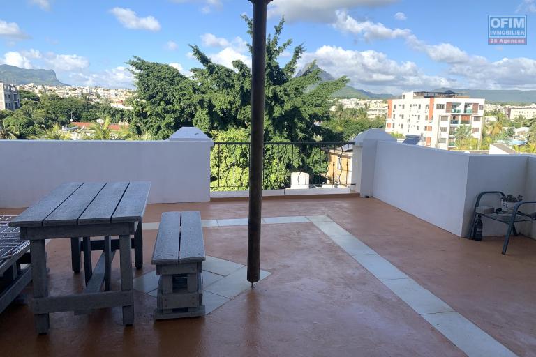 Flic en Flac for rent large studio in the city center located in a secure residence on the fourth floor without elevator with large terrace and swimming pool.