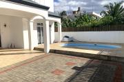 Flic En Flac for rent beautiful four bedroom air-conditioned villa with swimming pool in a quiet location seven minutes walk from the beach and shops.
