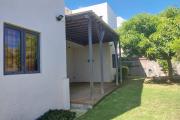 For sale a beautiful 4-bedroom family home with grassy and tree-lined courtyard in Grand Baie.