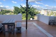 Flic en Flac for rent large studio in the city center located in a secure residence on the fourth floor without elevator with large terrace and swimming pool.