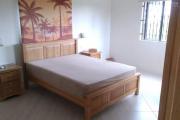 For rent a 3 bedroom apartment on the first floor of a house with a communal swimming pool in Grand Baie.