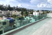 Flic en Flac for sale 3 bedroom penthouse accessible to foreigners with shared swimming pool near the beach.