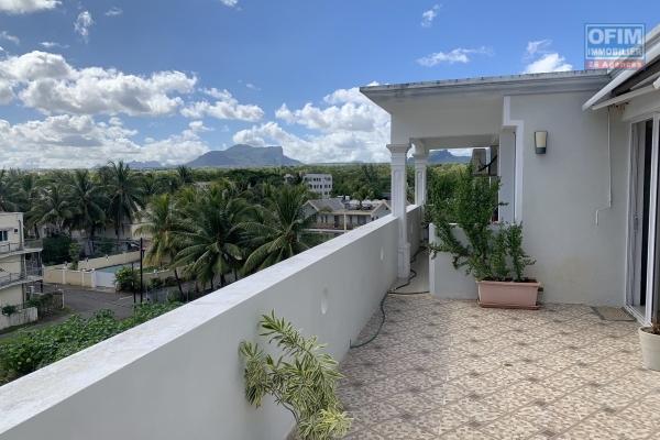 Flic en Flac for sale 2 bedroom penthouse located on the fourth floor without elevator. It is 20 meters from the quiet beach with stunning views.