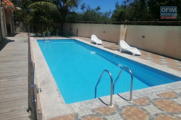 For sale a beautiful apartment with shared swimming pool and sea view in Grand Gaube.