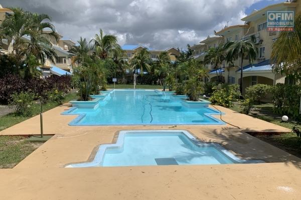 Flic En Flac for rent apartment located on the ground floor of a secure residence with two swimming pools close to the beach and shops.