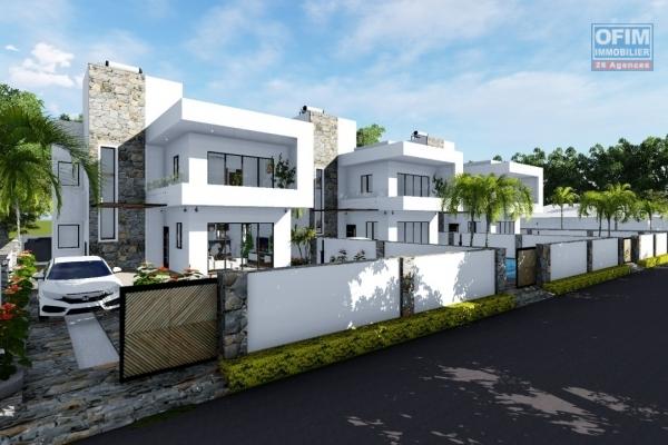 A vendre trois villas à Calodyne avec vue mer proche des commodités et du lagon.